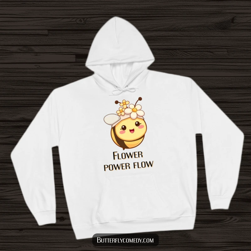 Funny bee with tiny antennae wearing a flower as a hat, designed for a warm and humorous hoodie.